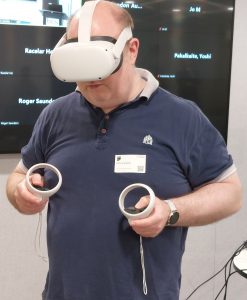 Nick Lambert, Chair of CAS, trying out VR at EVA London 2023
